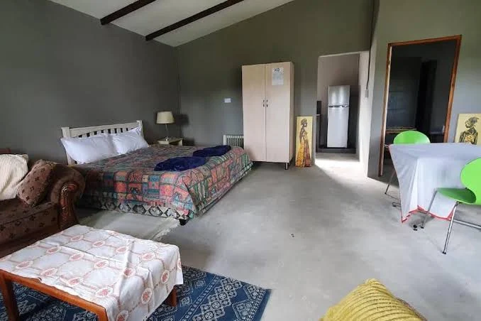Comfortable double room and lounge area at Hopefield Garden Lodge