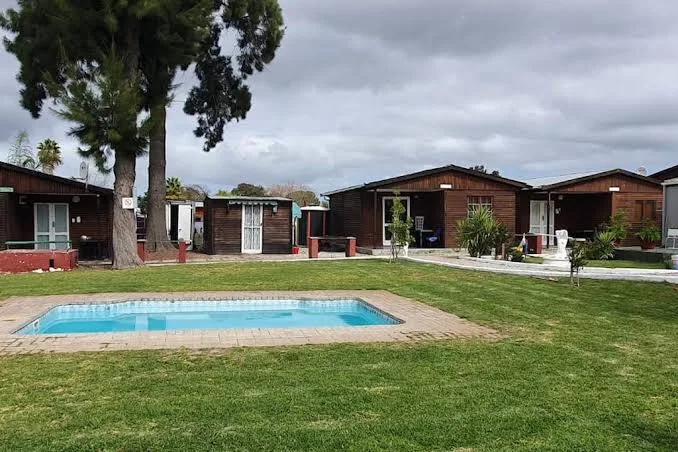 Garden and swimming pool at Hopefield Garden Lodge
