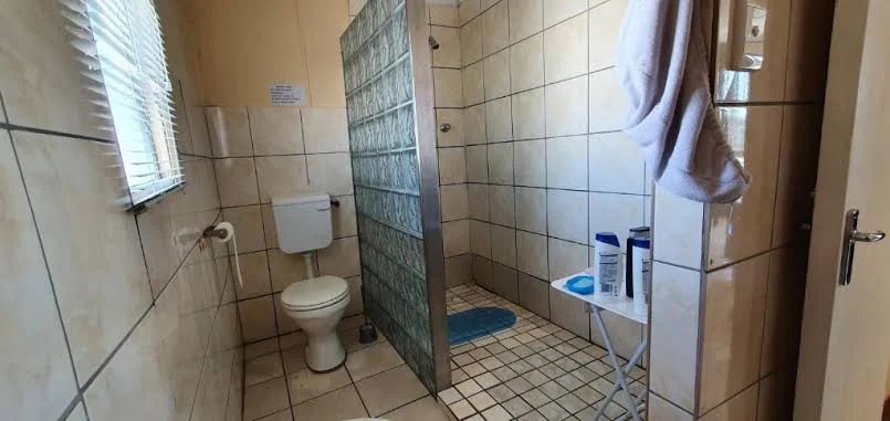 Tiled bathroom with walk-in shower at Hopefield Garden Lodge